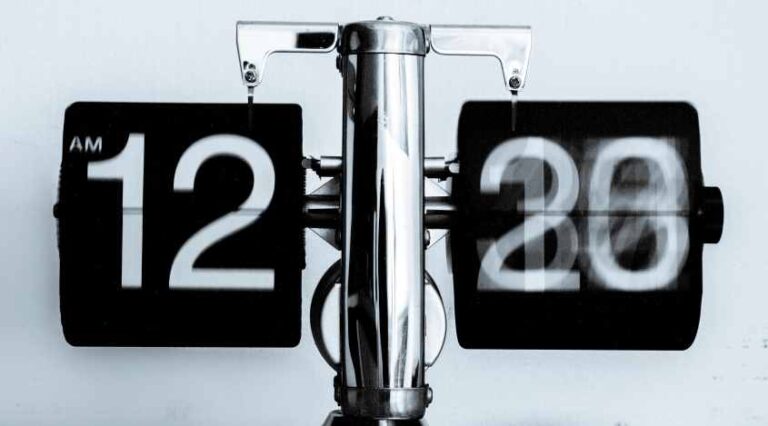 Photo of analog clock spinning quickly, by Djim Loic on Unsplash